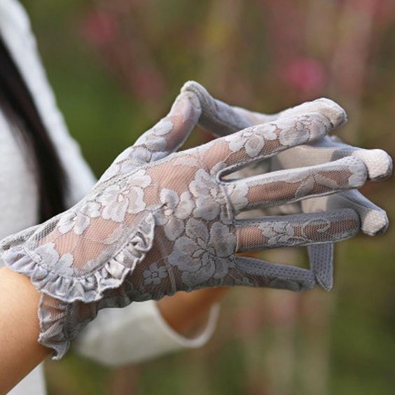 Woman's hands in grey tea gloves. 14 Bridgerton hen party ideas - party favours  - Tea Gloves