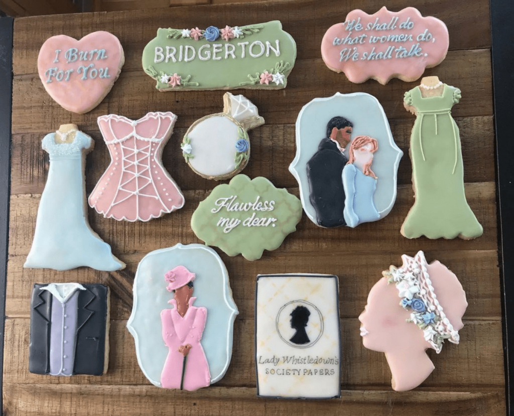A selection of Bridgerton themed pastel cookies -  14 Bridgerton hen party ideas - party food  - Themed cookies