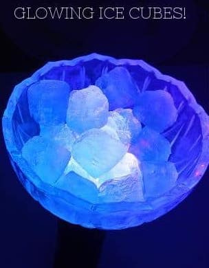 ice cubes in a bowl with a blue glow coming from them 