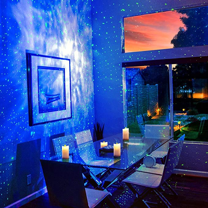 A night sky of blue and green projected onto the wall of a dining room 
